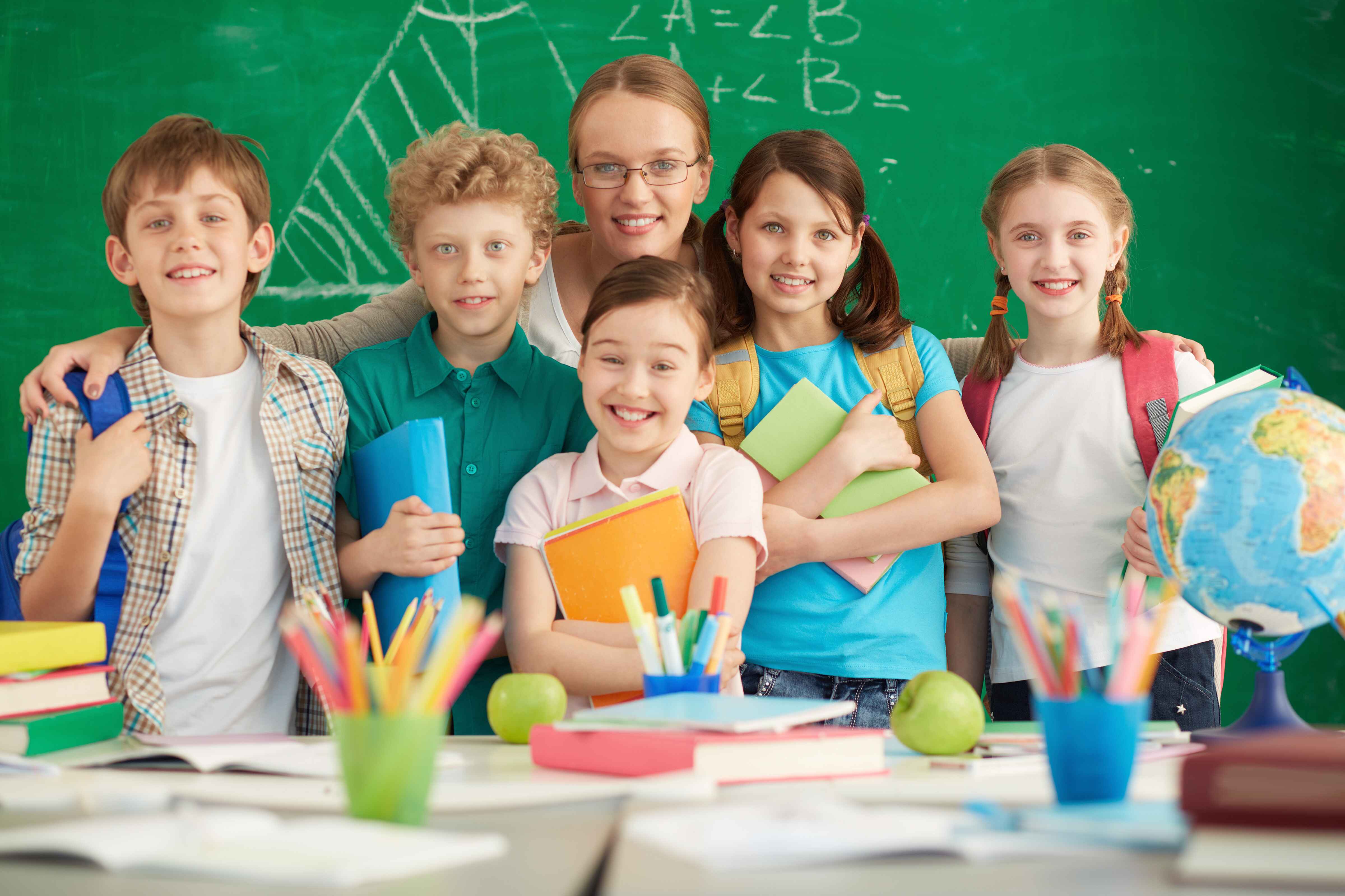 proud-teacher-with-her-elementary-students